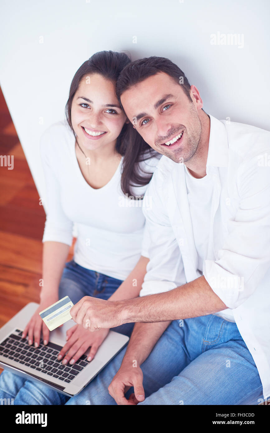 relaxed young couple working on laptop computer at home Stock Photo - Alamy