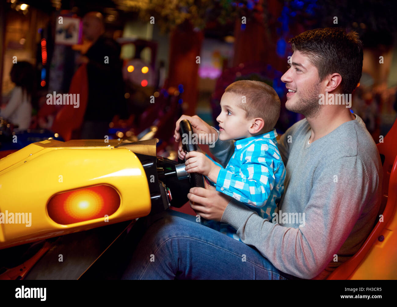father and son playing game in playground Stock Photo - Alamy