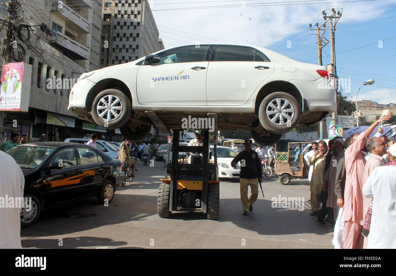Traffic police car lifter lifts car that parked in no parking area