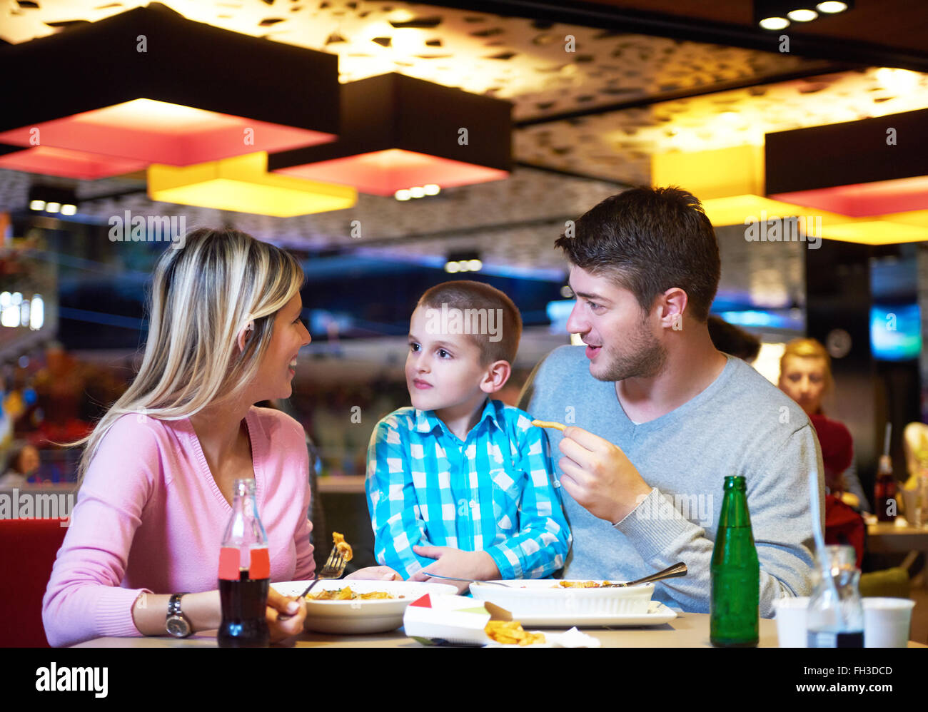 family having lunch in shopping mall Stock Photo