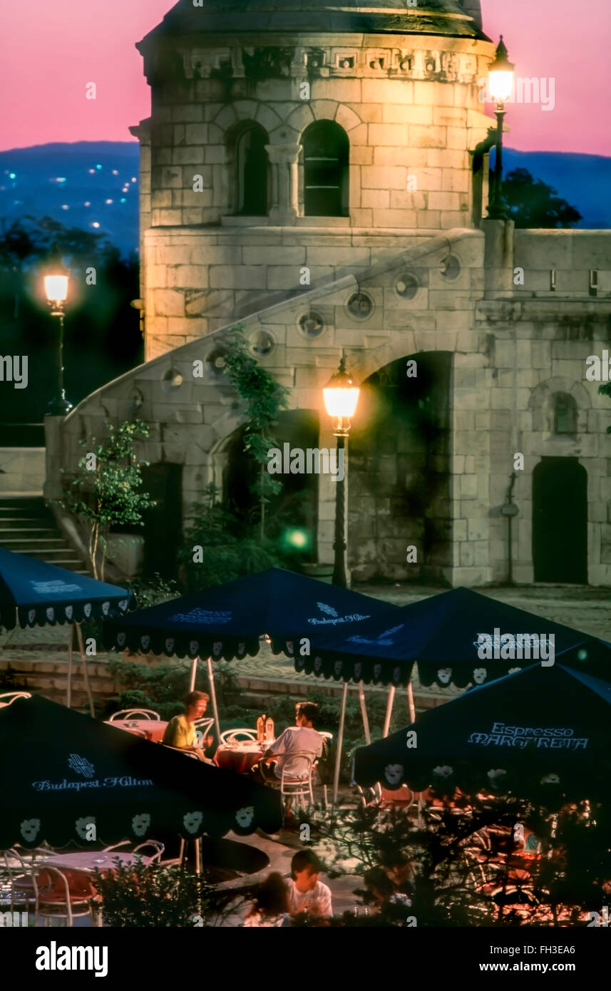 Budapest, Hungary - Hungarian Cafe Terrace,  TOurists on Terrace at Cafe at  Hilton Hotel, near Fishermen's Bastion, Center of Old City. restaurant view scenic people eating Stock Photo