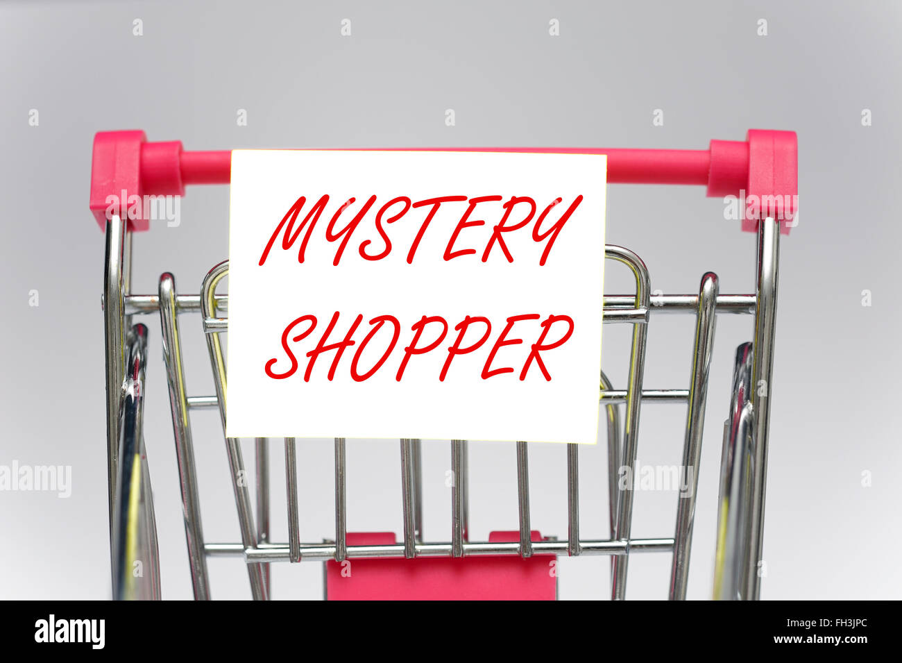 Mystery shopper on a supermarket shopping trolley Stock Photo Alamy