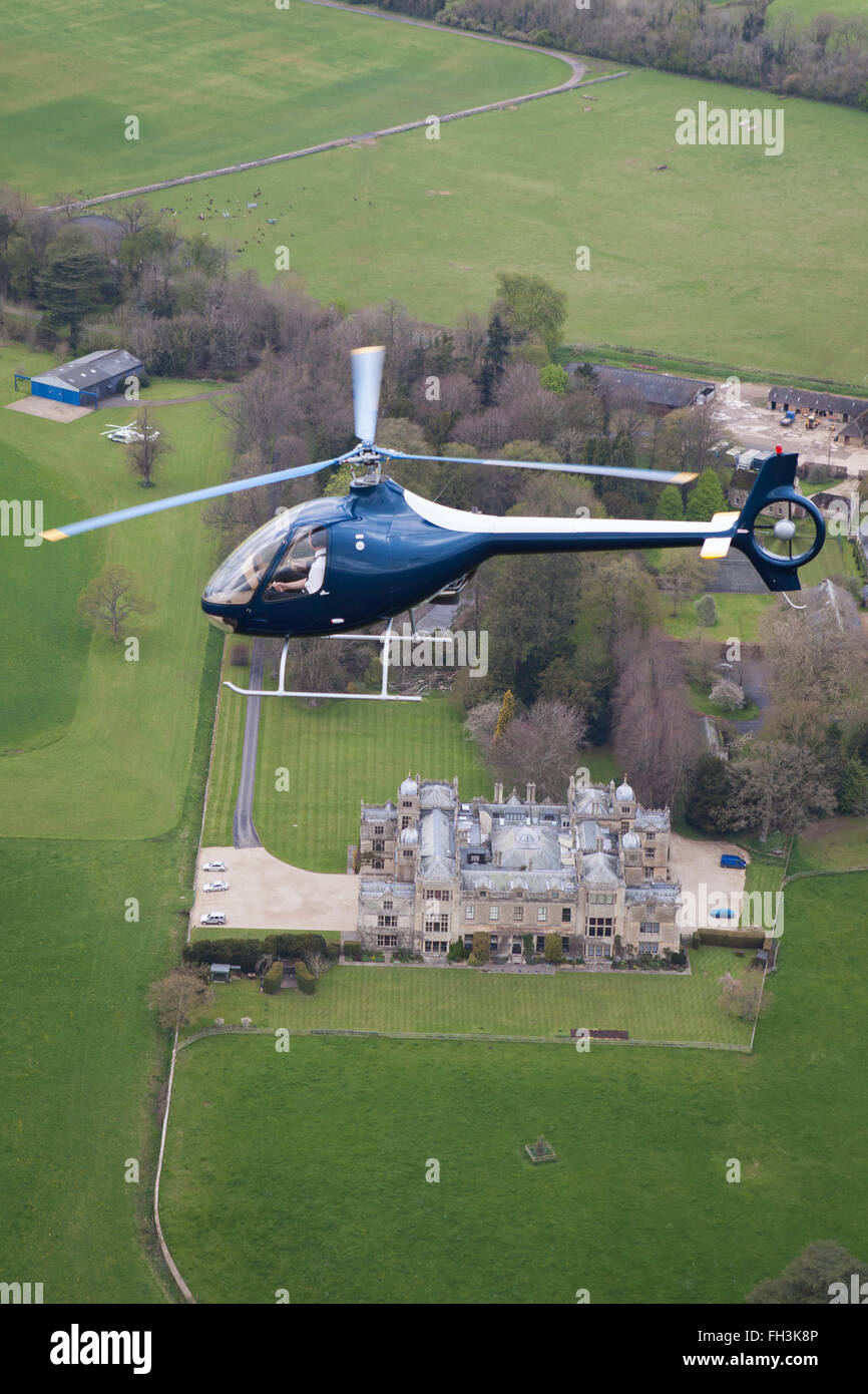 A Cabri G2 helicopter made by Guimbal flying over the cotswold