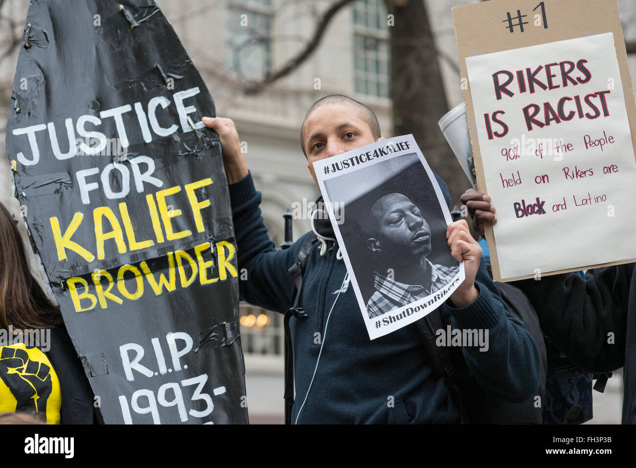 New York, United States. 23rd Feb, 2016. Demonstrators hold aloft a symbolic coffin bearing Kalief Browder's name as they rally near the gate of City Hall. A confederacy of about a dozen prison reform activists rallied at City Hall in New York City to demand that it close the long-controversial Rikers Island Corrections facility where, among others, Kalief Browder, died; critics maintain that the prison is unsafe and prolonged detention of inmates at the facility is a violation of Constitutional due process rights. Credit:  Albin Lohr-Jones/Pacific Press/Alamy Live News Stock Photo