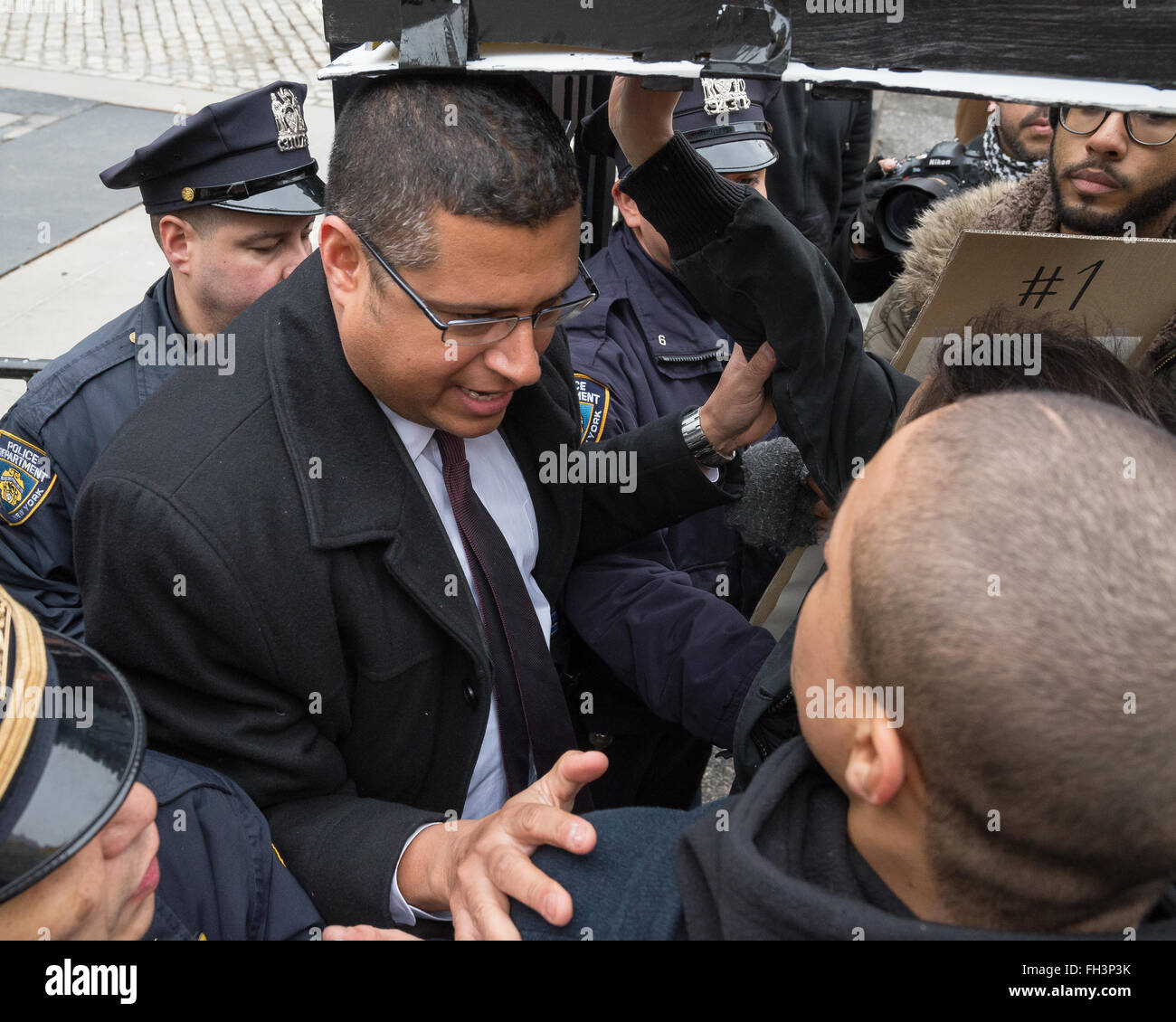 New York, United States. 23rd Feb, 2016. Demonstrators carrying aloft a symbolic coffin are forcibly turned back by City Hall security officers as they attempt to enter. A confederacy of about a dozen prison reform activists rallied at City Hall in New York City to demand that it close the long-controversial Rikers Island Corrections facility where, among others, Kalief Browder, died; critics maintain that the prison is unsafe and prolonged detention of inmates at the facility is a violation of Constitutional due process rights. Credit:  Albin Lohr-Jones/Pacific Press/Alamy Live News Stock Photo