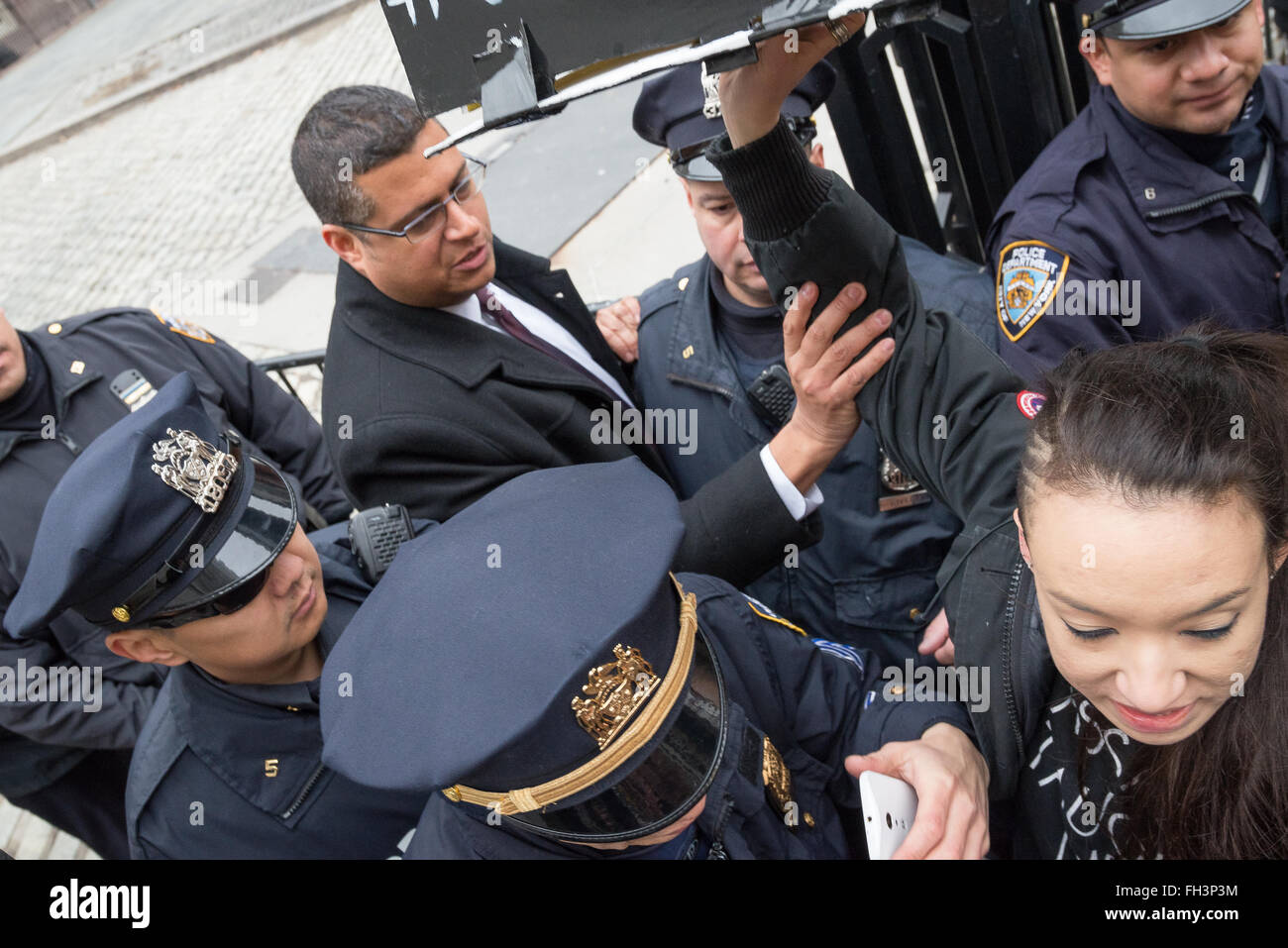 New York, United States. 23rd Feb, 2016. Demonstrators carrying aloft a symbolic coffin are forcibly turned back by City Hall security officers as they attempt to enter. A confederacy of about a dozen prison reform activists rallied at City Hall in New York City to demand that it close the long-controversial Rikers Island Corrections facility where, among others, Kalief Browder, died; critics maintain that the prison is unsafe and prolonged detention of inmates at the facility is a violation of Constitutional due process rights. Credit:  Albin Lohr-Jones/Pacific Press/Alamy Live News Stock Photo