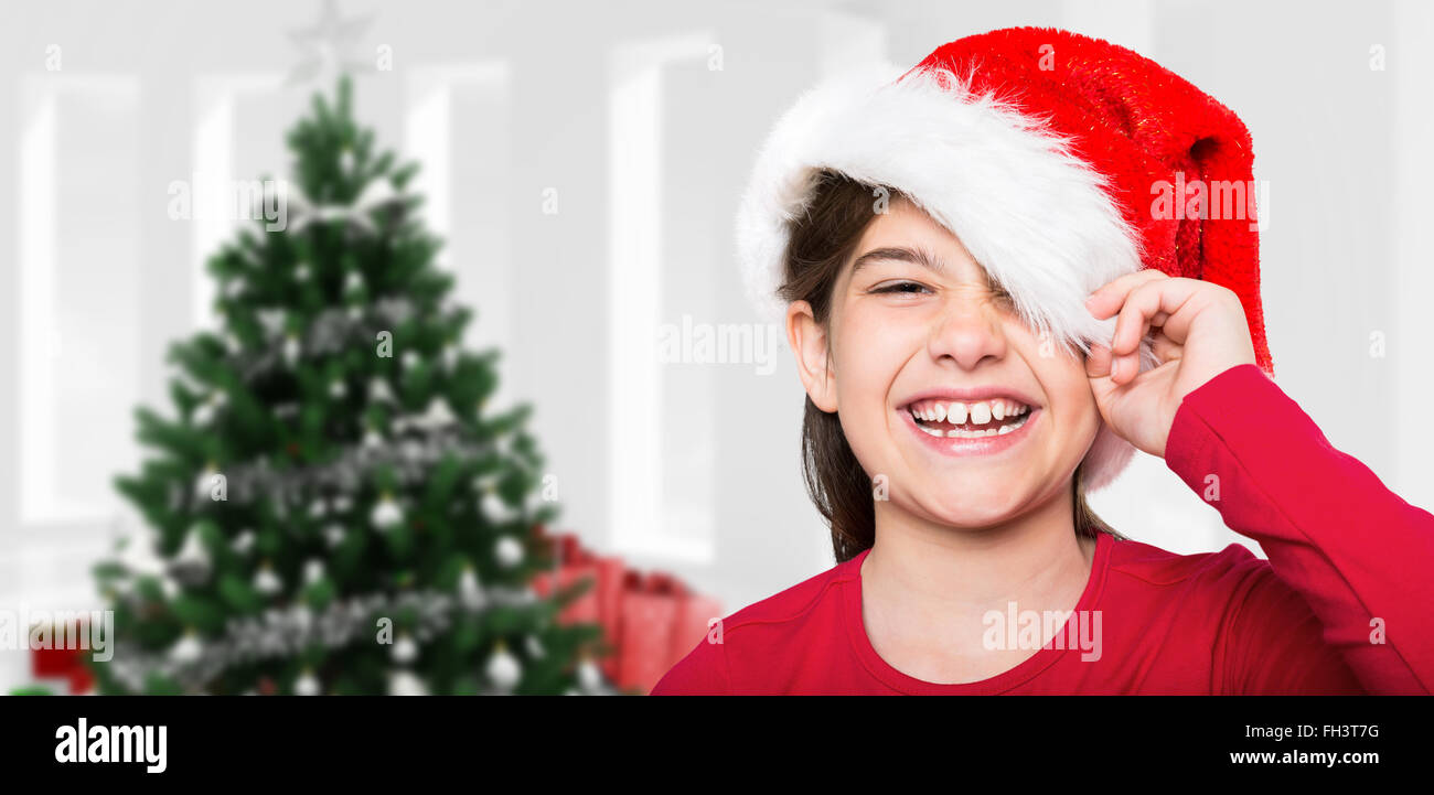 Composite image of festive little girl smiling at camera Stock Photo ...