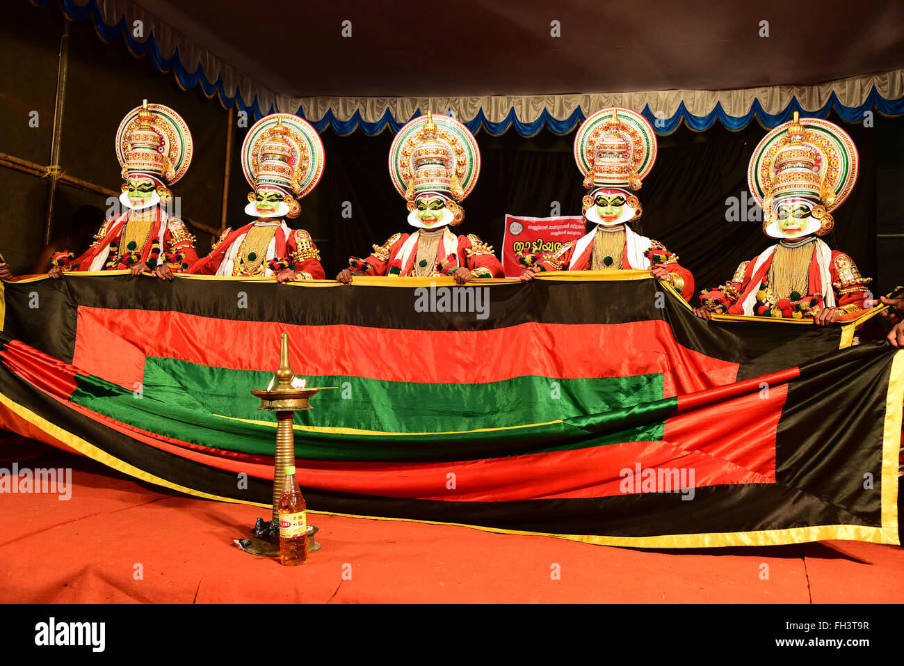 Kathakali is a stylized classical Indian dance-drama noted for the attractive make-up of characters, elaborate costumes, detaile Stock Photo