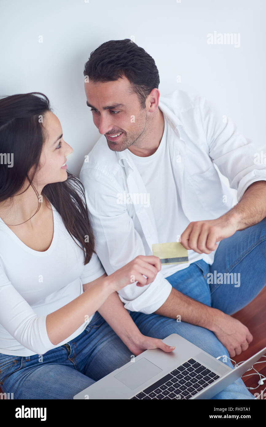 relaxed young couple working on laptop computer at home Stock Photo - Alamy
