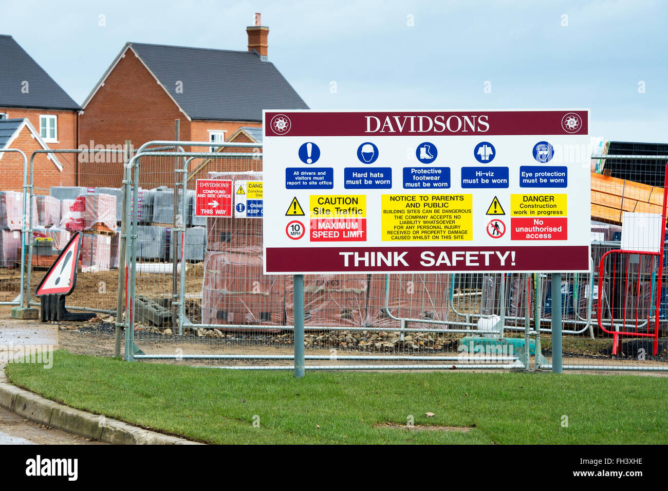 Health and Safety signs on the perimeter of Davidsons Housing construction site in Brackley, Northamptonshire, England Stock Photo