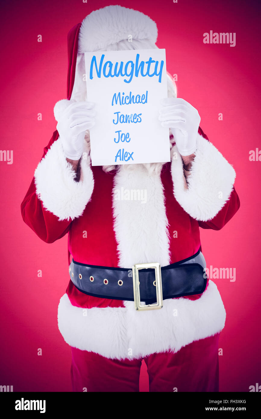 Composite image of santa claus presenting card Stock Photo - Alamy