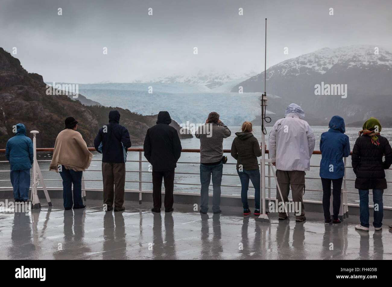Passengers on board the cruise ship Veendam viewing Amilia Glacier Stock Photo