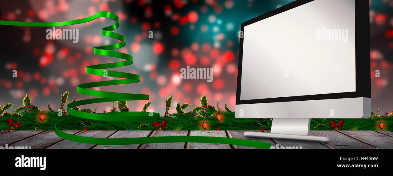 Composite image of green christmas tree ribbon Stock Photo Alamy