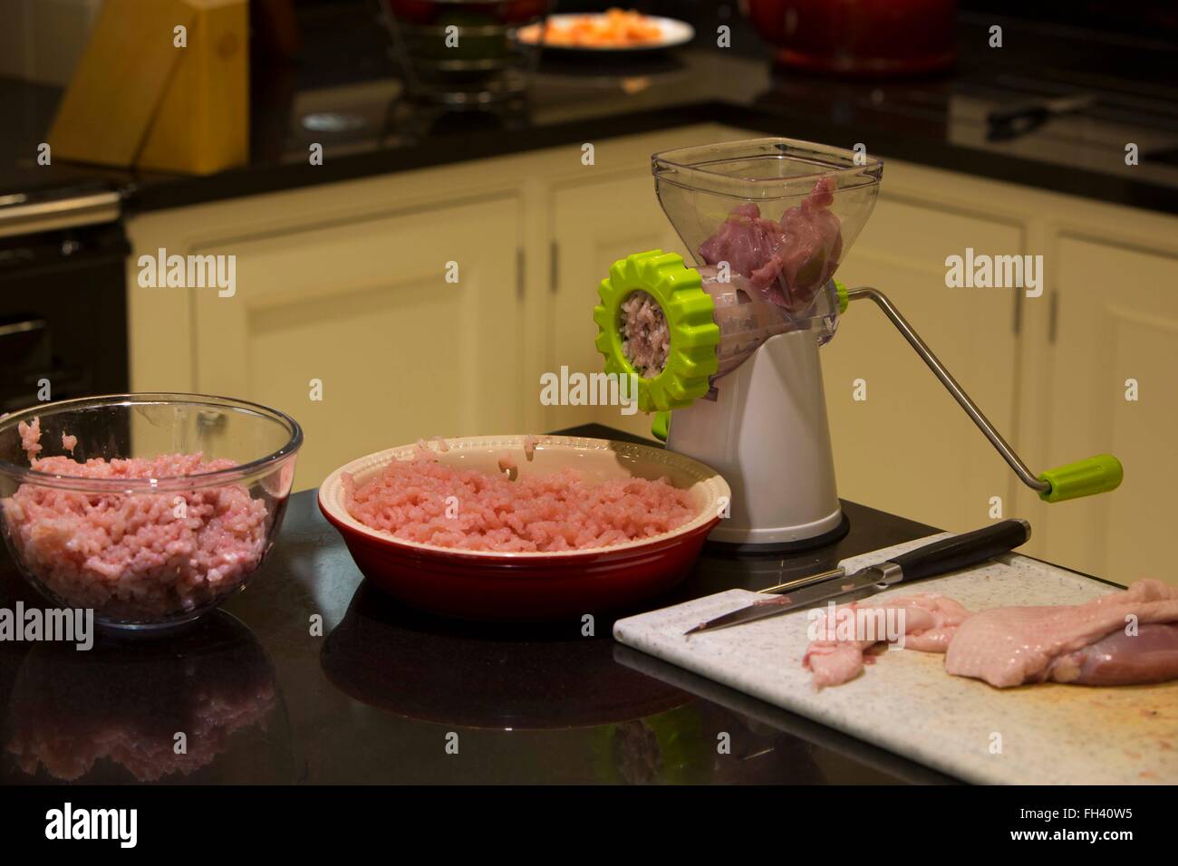 Chicken thighs and minced turkey on a family home kitchen work top in preparation of low calorie meals for a weight loss diet Stock Photo