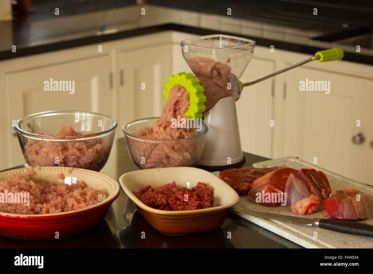 The home cook is preparing all sorts of minced meat to create meal sized batches that can be frozen and quickly heated up later. Stock Photo