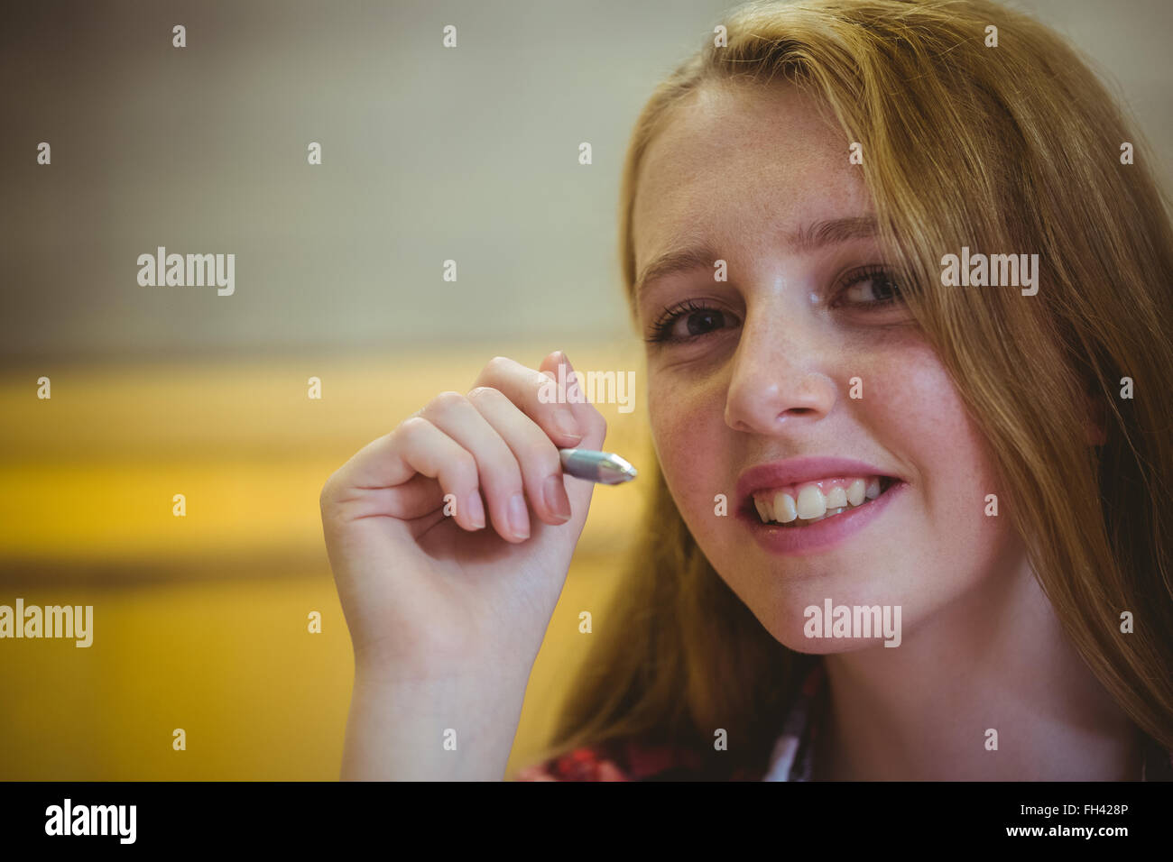 Smiling student looking at the camera Stock Photo - Alamy