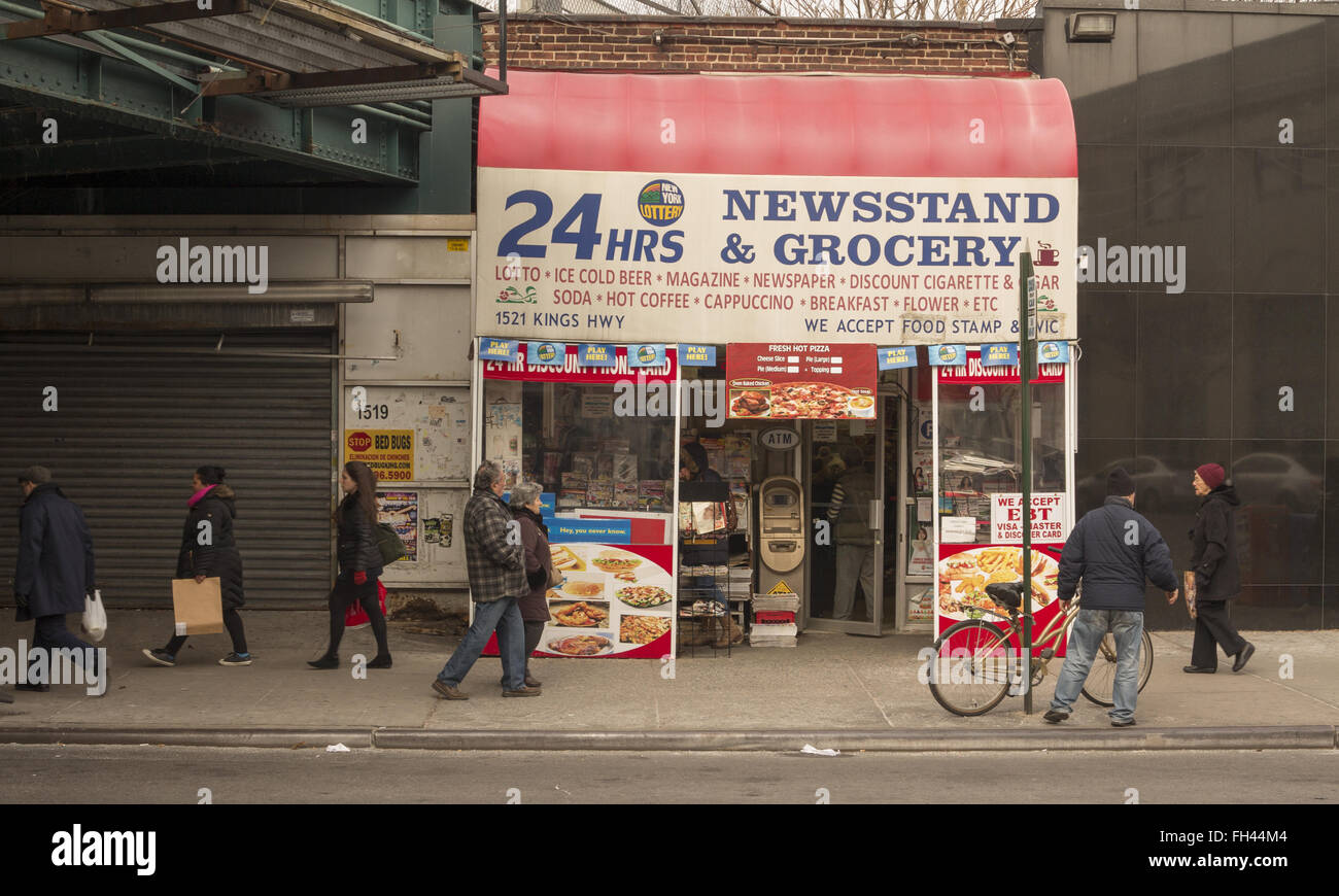 Newsstand & grocery under the elevat4d subway station at Kings Highway in Brooklyn, NY. Stock Photo