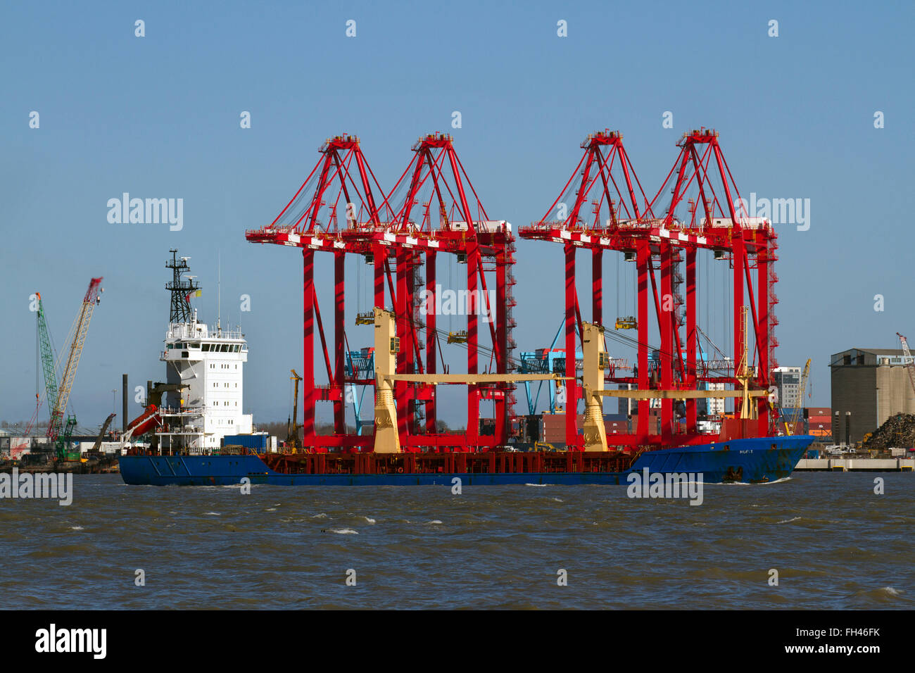 Operational cantilever rail-mounted gantry (CRMG) cranes Liverpool2, Liverpool Two container terminal extension adjoining the River Mersey in Seaforth, a £400 million investment to create a new deep-water container terminal at the Port of Liverpool, enabling the largest vessels to unload directly in the city.  Vessel NOFIT (IMO: 9137739, MMSI: 428061000) is a general cargo ship buit in 1997 and currently sailing under the flag of Israel. NOFIT has 94m length overall and beam of 17m. Her gross tonnage is 4078 tons and is here picture entering the Port of Liverpool, opposite Seaforth Dock, UK Stock Photo