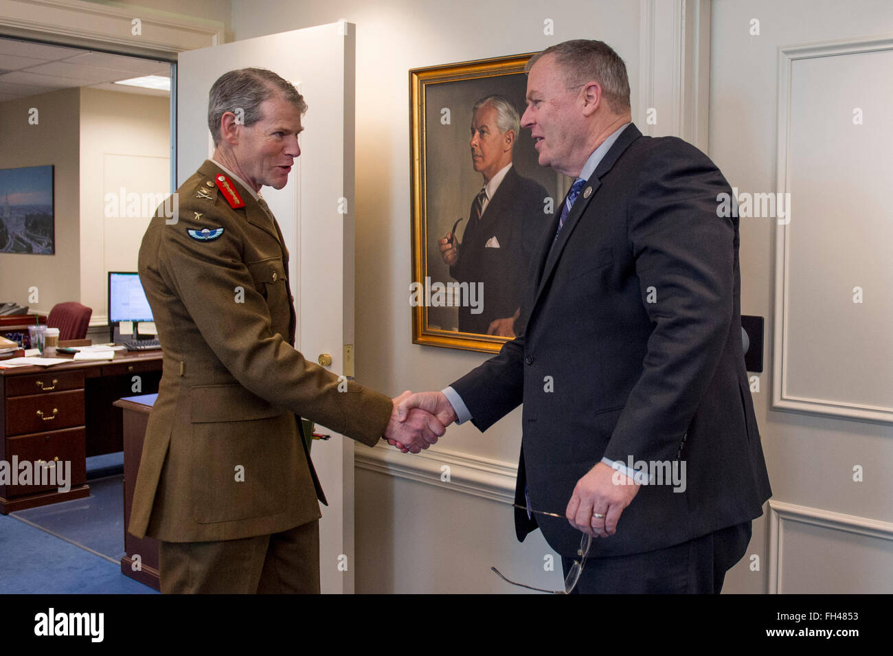 Deputy Secretary of Defense Bob Work greets Deputy Supreme Allied Commander Europe General Sir Adrian Bradshaw at the Pentagon, Feb. 22, 2016. The two leaders met to discuss matters of mutual importance. Stock Photo