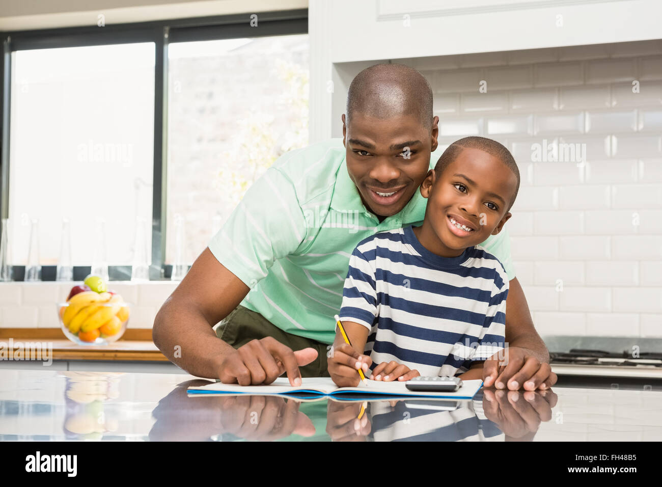 Father helping his son with homework Stock Photo - Alamy