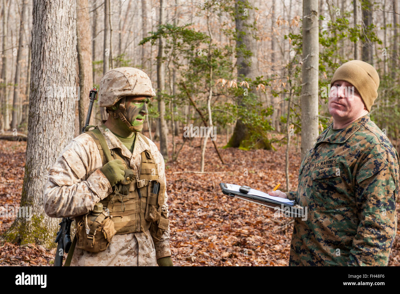 Candidates assigned to Delta Company, Officer Candidates Class-221, are evaluated as members of a fire team during the Small Unit Leadership Evaluation 1 at Brown Field, Marine Corps Base Quantico, Va., on Feb. 22, 2016. The mission of Officer Candidates School (OCS) is to 'educate and train officer candidates in Marine Corps knowledge and skills within a controlled, challenging, and chaotic environment in order to evaluate and screen individuals for the leadership, moral, mental, and physical qualities required for commissioning as a Marine Corps officer.' Stock Photo