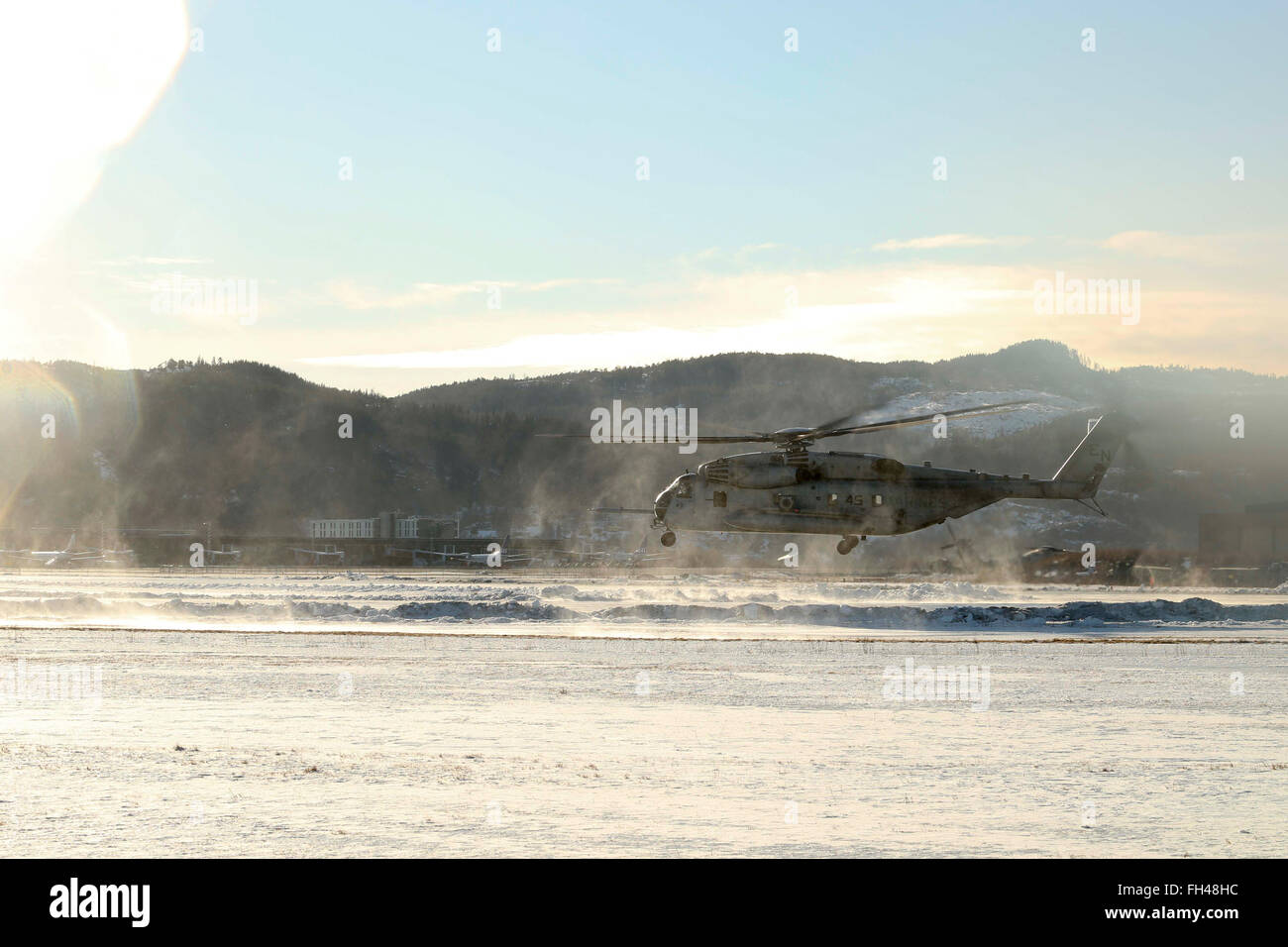A U.S. Marine Corps CH-53E Super Stallion Helicopter begins its accent at Vaernes, Norway, Feb. 22, 2016, as 2nd Marine Expeditionary Brigade prepares for Exercise Cold Response. All aircraft with Marine Heavy Helicopter Squadron (-) Reinforced, the Air Combat Element of 2d MEB, were dismantled at Marine Corps Air Station Cherry Point, N.C., and flown to Norway in U.S. Air Force C-5 Galaxies to provide air support during the exercise. Cold Response 16 is a combined, joint exercise comprised of 12 NATO allies and partnered nations and approximately 16,000 troops. Stock Photo