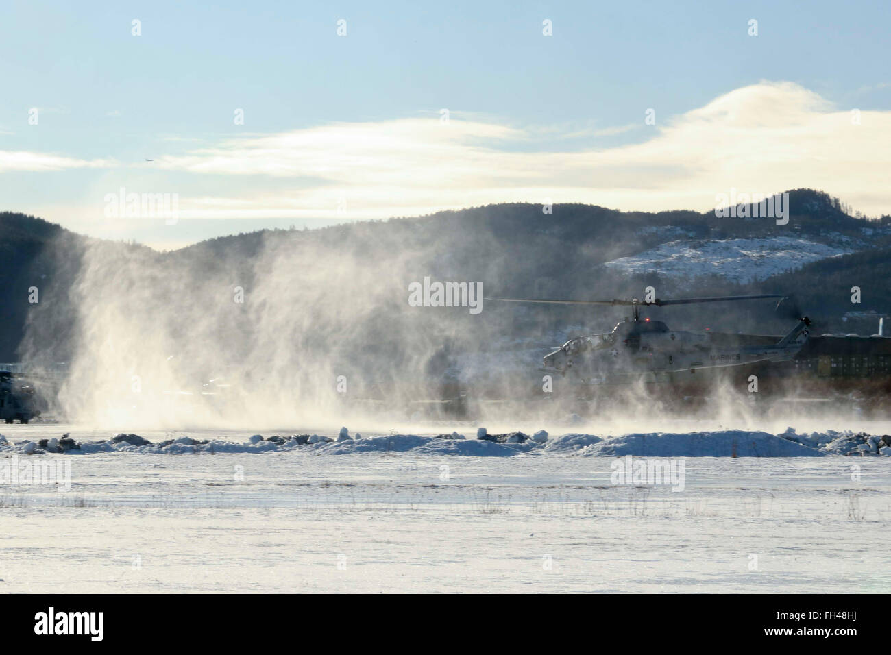 A U.S. Marine Corps AH-1W Super Cobra helicopter takes lift at Vaernes, Norway, Feb. 22, 2016, as 2nd Marine Expeditionary Brigade prepares for Exercise Cold Response 2016.  All aircraft with Marine Heavy Helicopter Squadron (-) Reinforced, the Air Combat Element of 2d MEB, were dismantled at Marine Corps Air Station Cherry Point, N.C., and flown to Norway in U.S. Air Force C-5 Galaxies to provide air support during the exercise. Cold Response 16 is a combined, joint exercise comprised of 12 NATO allies and partnered nations and approximately 16,000 troops. Stock Photo