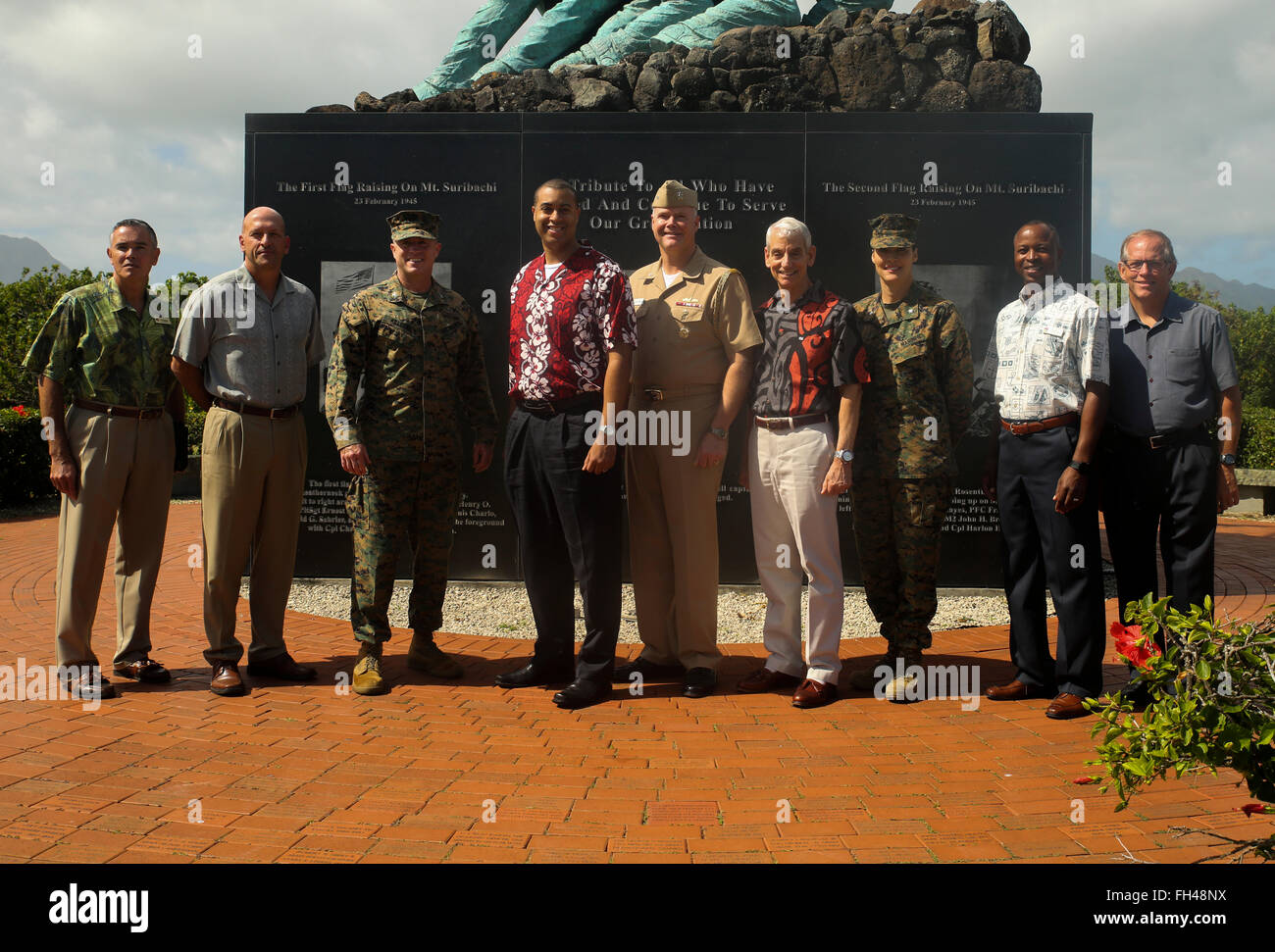 Franklin Parker, the assistant secretary of the Navy (manpower and reserved affairs), poses in front of the Pacific War Memorial with Col. Sean Killeen, the commanding officer for MCB Hawaii, and their staff aboard Marine Corps Base Hawaii, Feb. 22, 2016. Parker was nominated as assistant secretary of the Navy in January. He visited Marine Corps Base Hawaii “I came here to know more about them and what they do,” Parker said. “I also wanted to show my face since I’m new.” Stock Photo