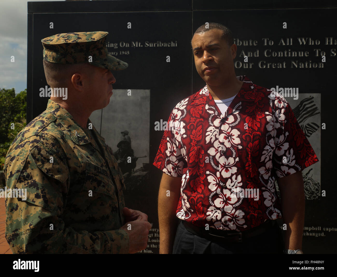 Col. Sean Killeen, the commanding officer for Marine Corps Base Hawaii, talks to Franklin Parker, the secretary of the Navy (manpower and reserved affairs), at the Pacific War Memorial, Feb. 22, 2016. Parker, a Joliet, Ill., native, visited MCB Hawaii in hopes to learn more about Marines and Sailors. “I came here to know more about them and what they do,” Parker said. “I also wanted to show my face, since I’m new, and answer any questions.” Stock Photo