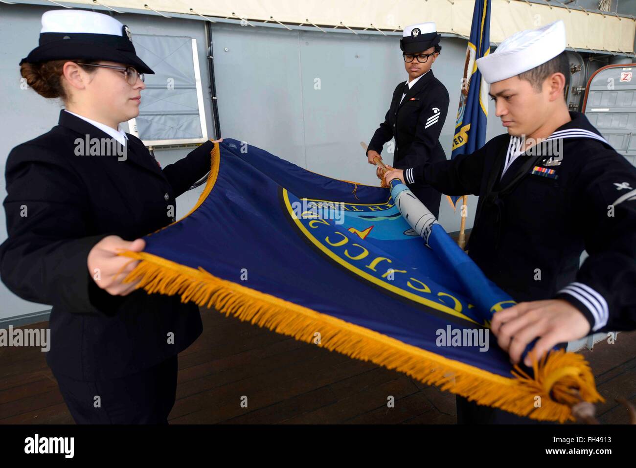 Italy (Feb. 22, 2016) Sailors aboard the U.S. 6th Fleet command and control ship USS Mount Whitney (LCC 20) secure the command pennant after the flagship departed Gaeta, Italy, Feb. 22, 2016. Mount Whitney, the U.S. 6th Fleet command and control ship, forward deployed to Gaeta, Italy, is conducting naval operations in the U.S. 6th Fleet area of operations in support  of U.S. National security interests in Europe. Stock Photo