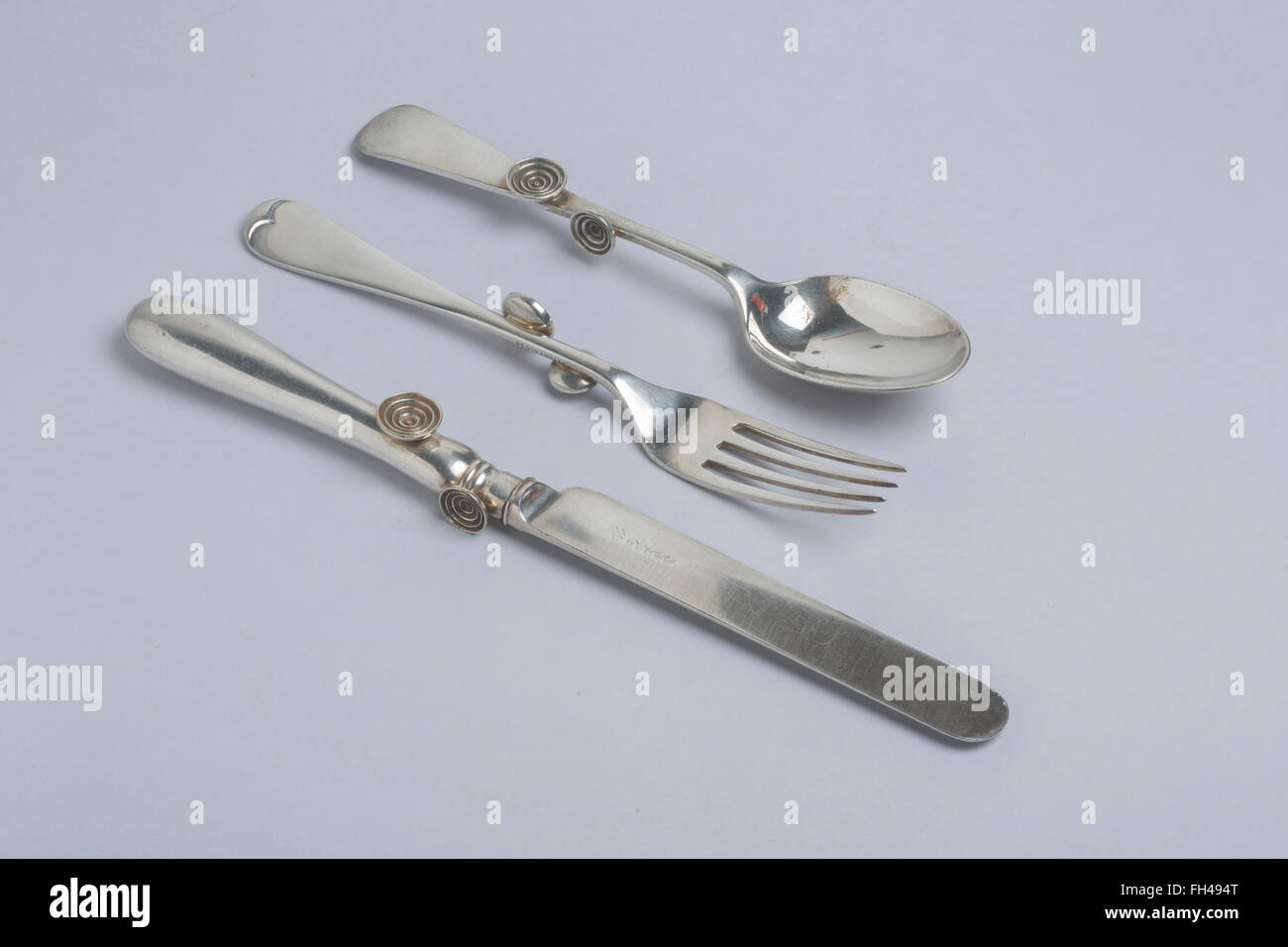 Etiquette cutlery, patented 1910, for training children to hold their table cutlery properly.  William Hutton, Sheffield. Stock Photo