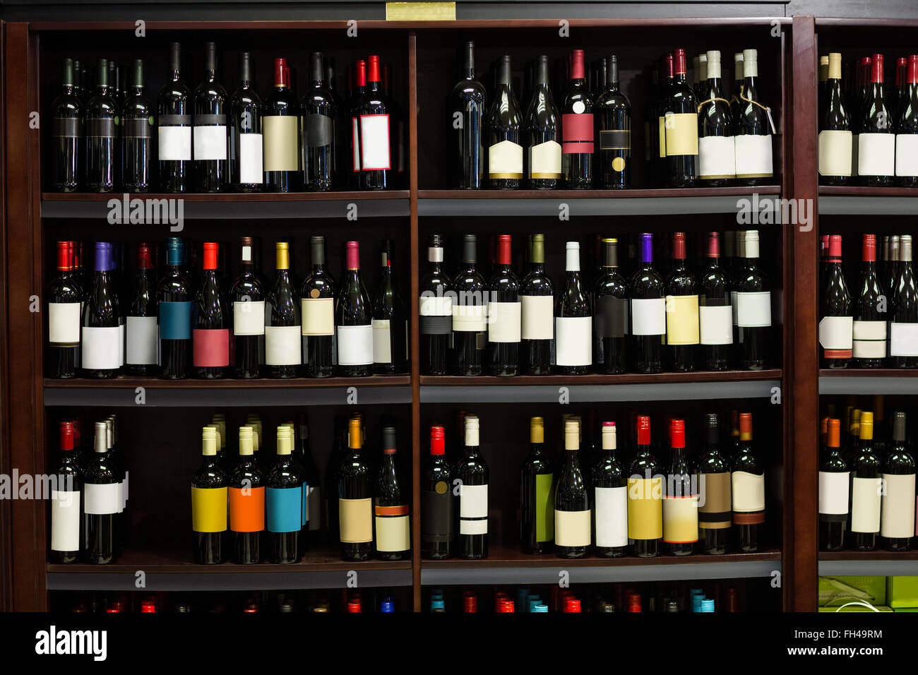 View of row bottles of wine Stock Photo - Alamy