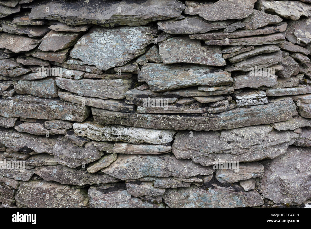 drystone wall of beehive hut, clochan, 6th century on Skellig michael Stock Photo