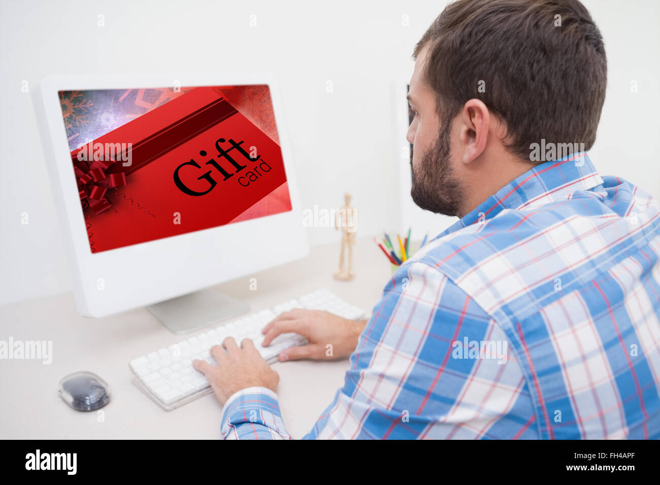 Composite image of gift card with festive bow Stock Photo