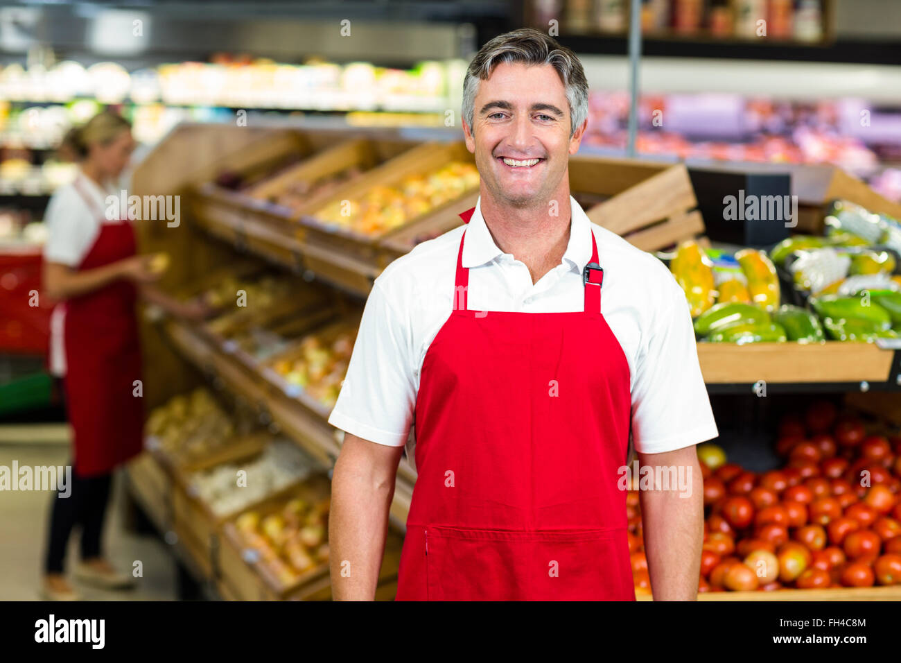 Supermarket worker wearing apron hi-res stock photography and images ...