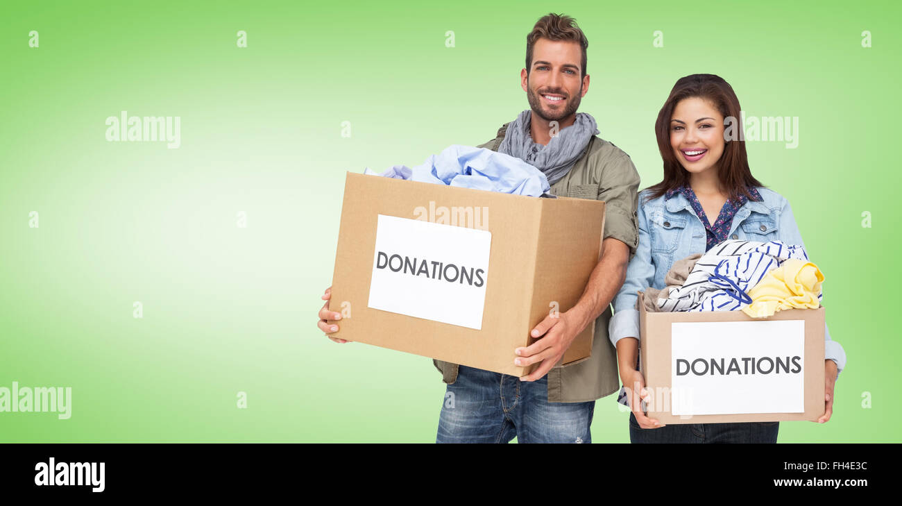 Composite image of portrait of a happy young couple with clothes donation Stock Photo