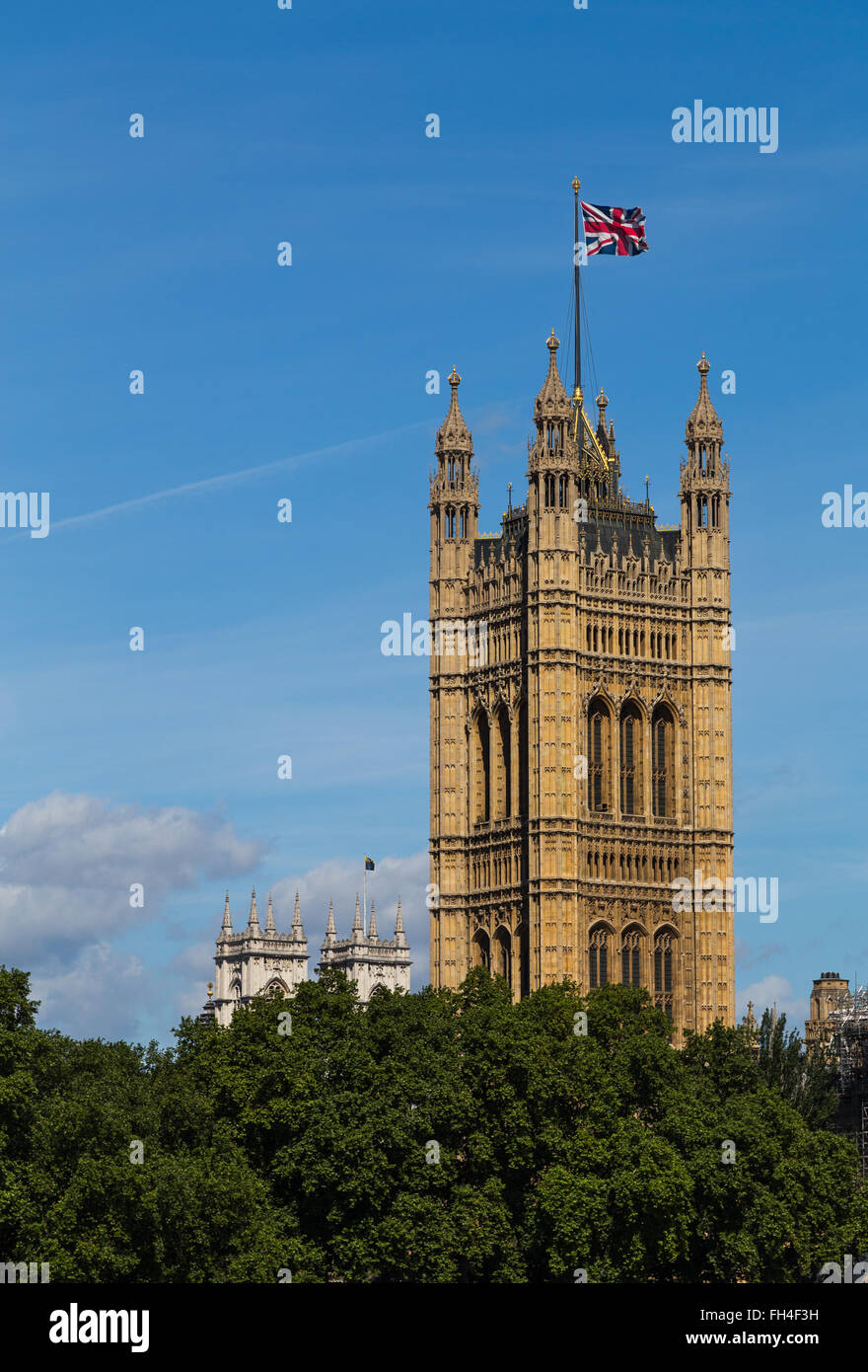 The Victoria Tower in London during the summer with the Union Jack Flag flying at the top of it Stock Photo