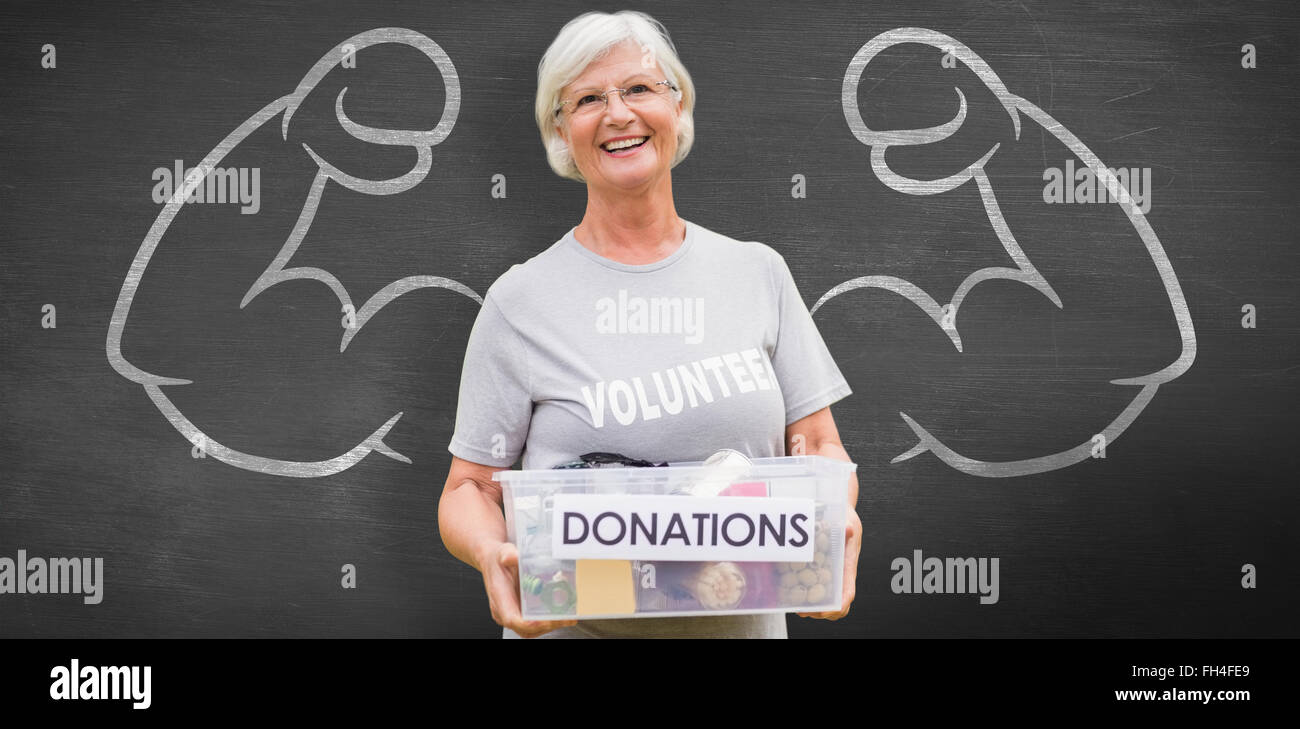 Composite image of happy grandmother holding donation box Stock Photo