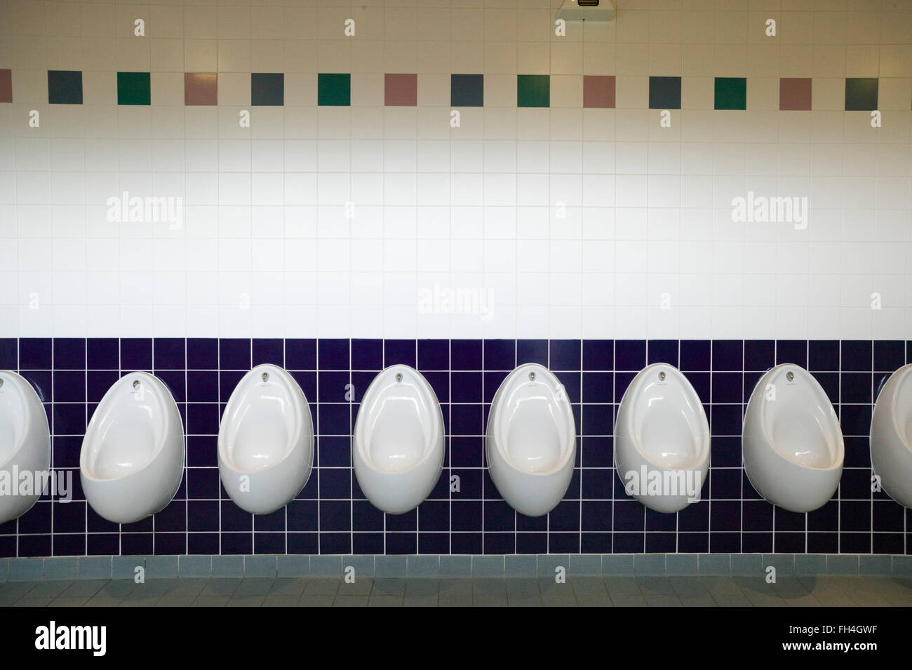 A line of urinals in a male public toilet Stock Photo Alamy
