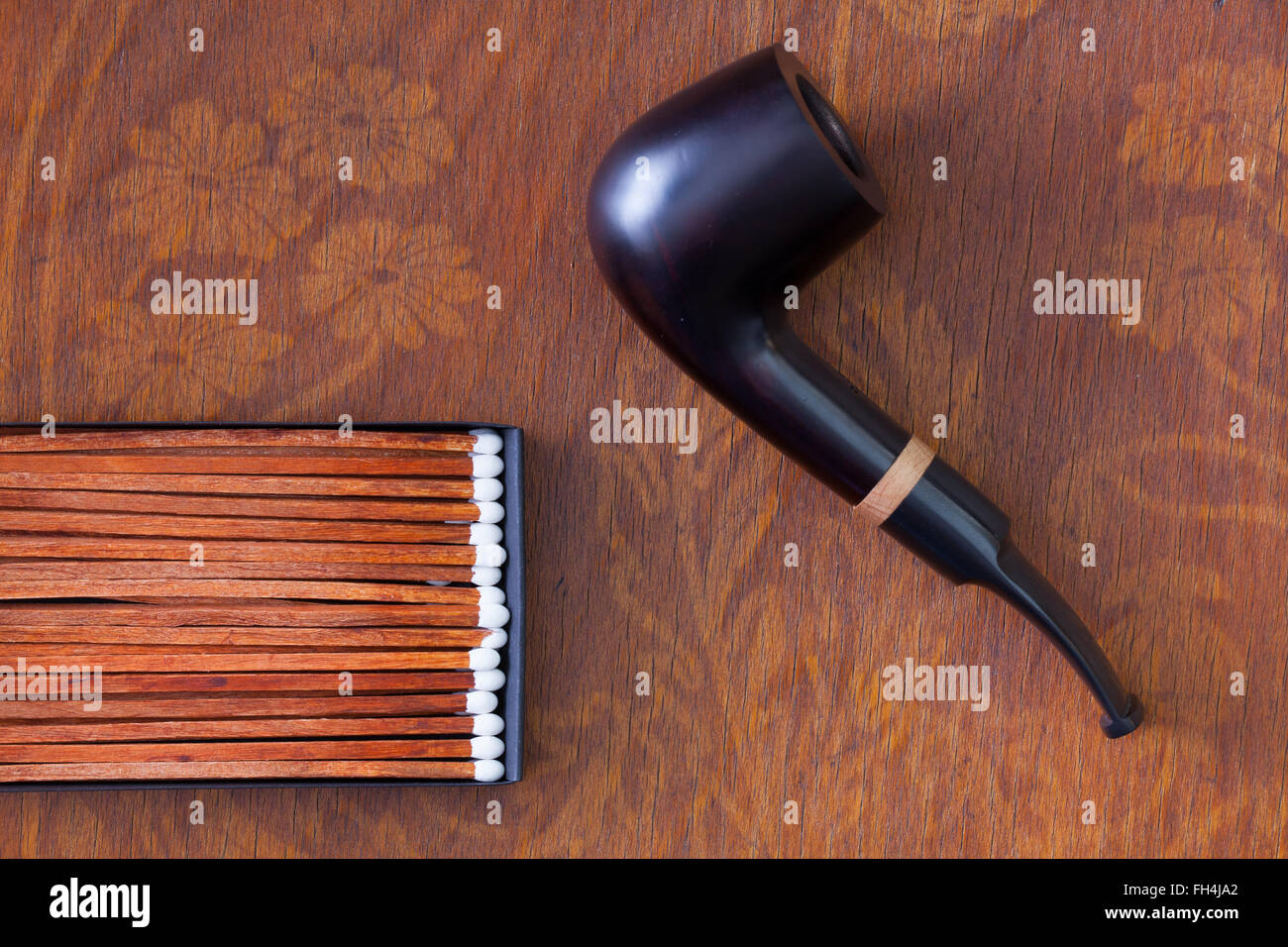 Luxury tobacco pipe on wooden table Stock Photo Alamy