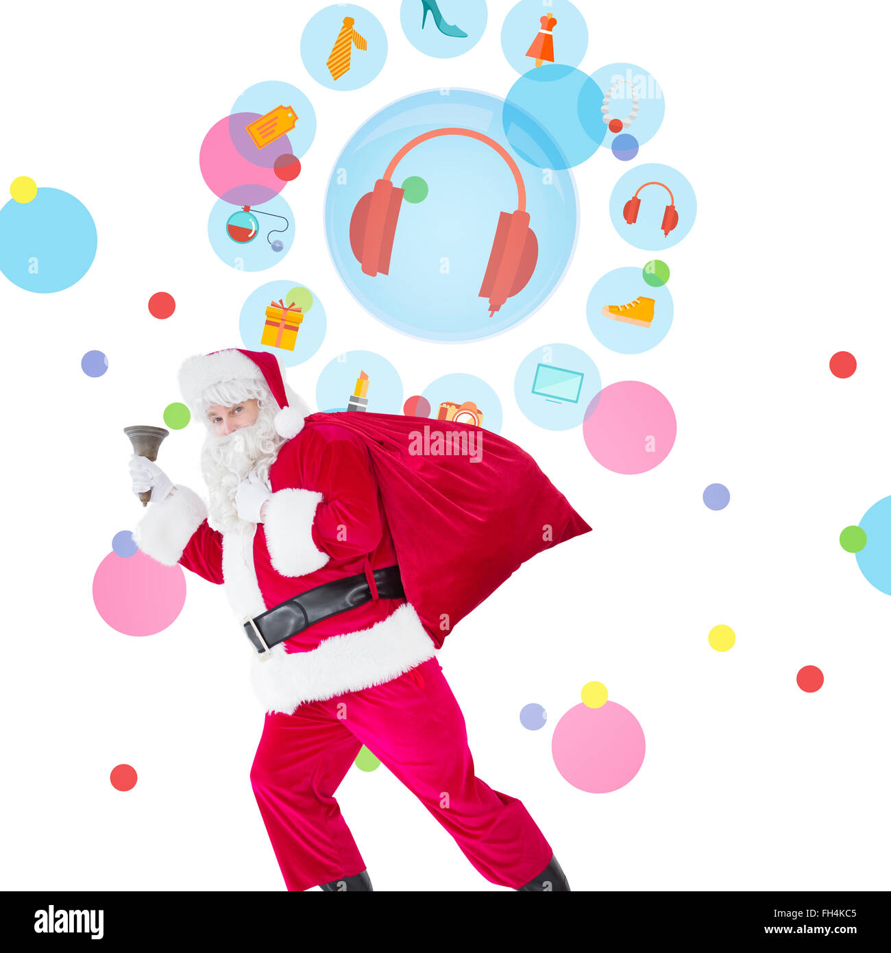 Composite image of santa walking with his sack and bell Stock Photo - Alamy