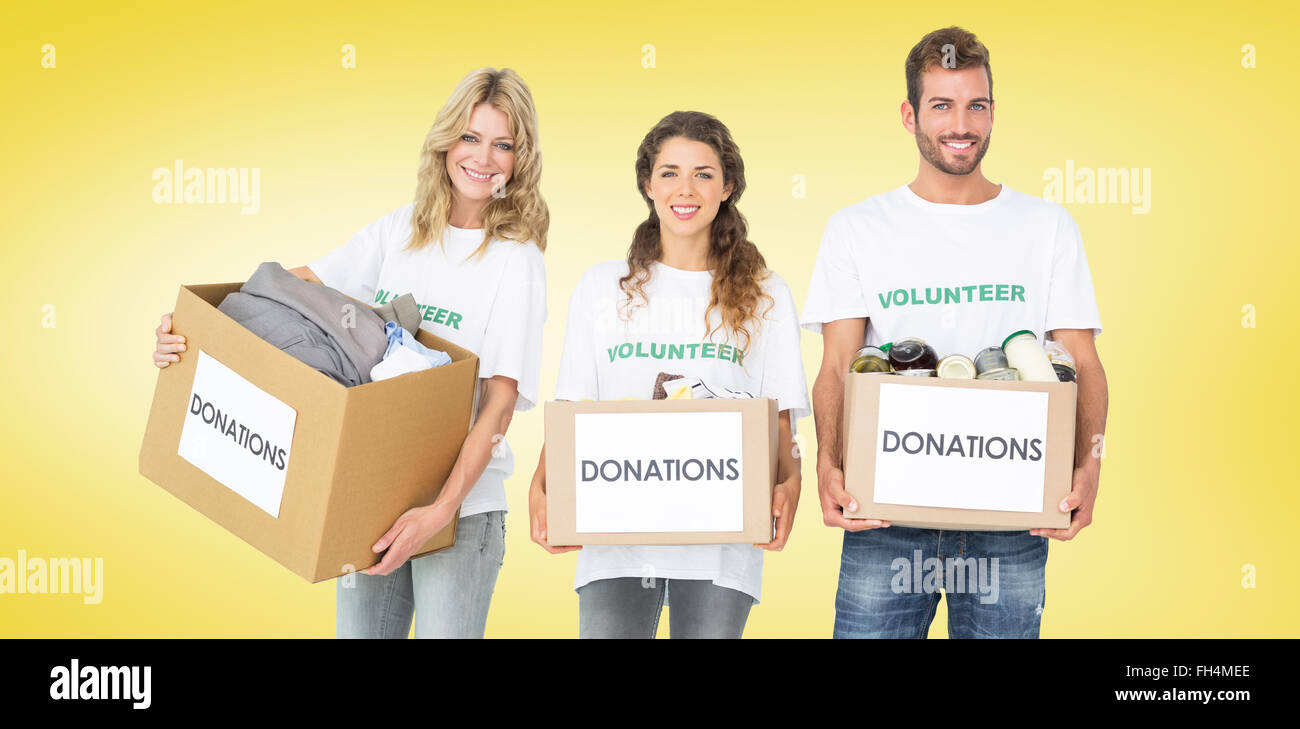 Composite image of portrait of three smiling young people with donation boxes Stock Photo