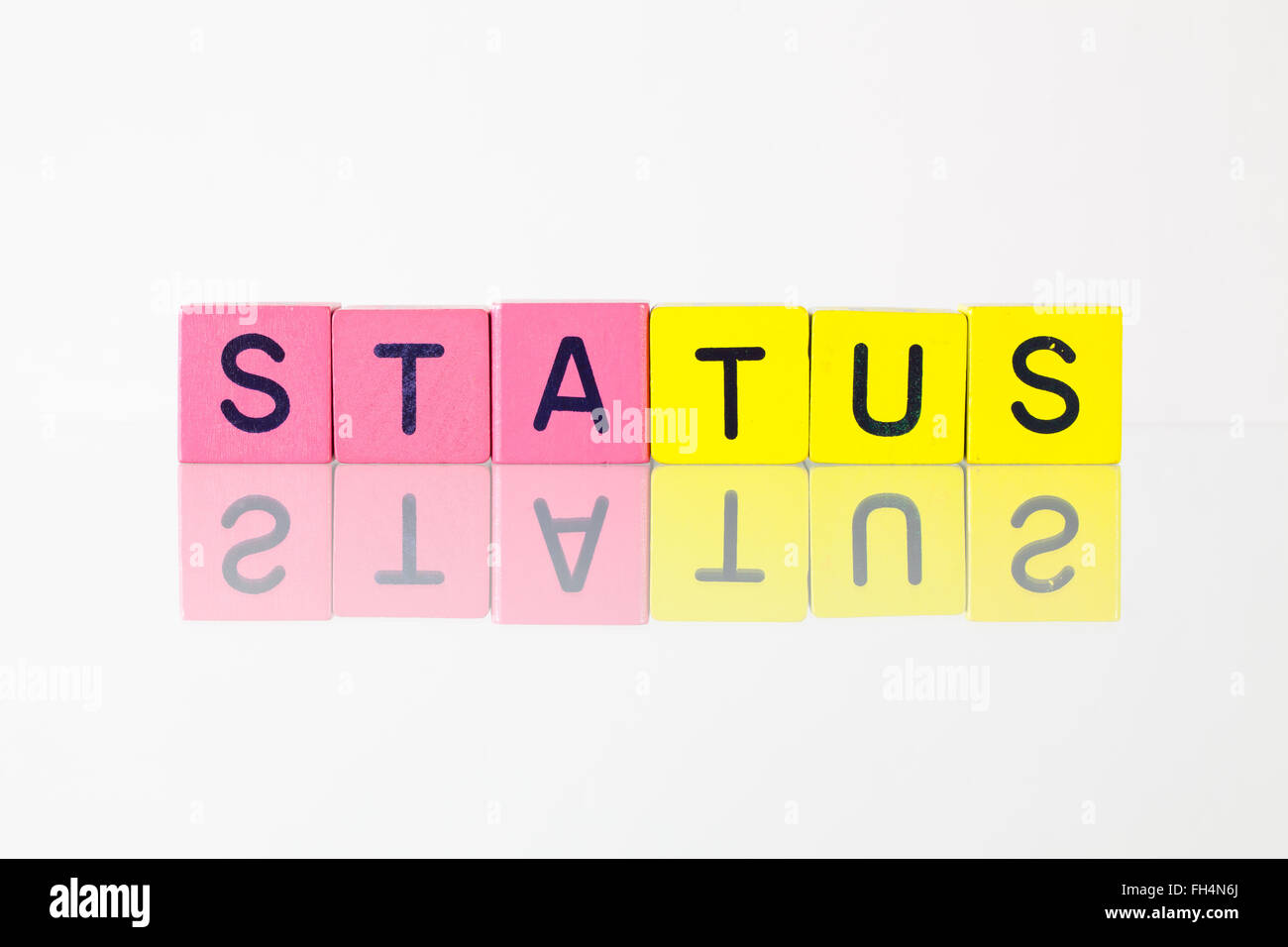 Status - an inscription from children's wooden blocks Stock Photo