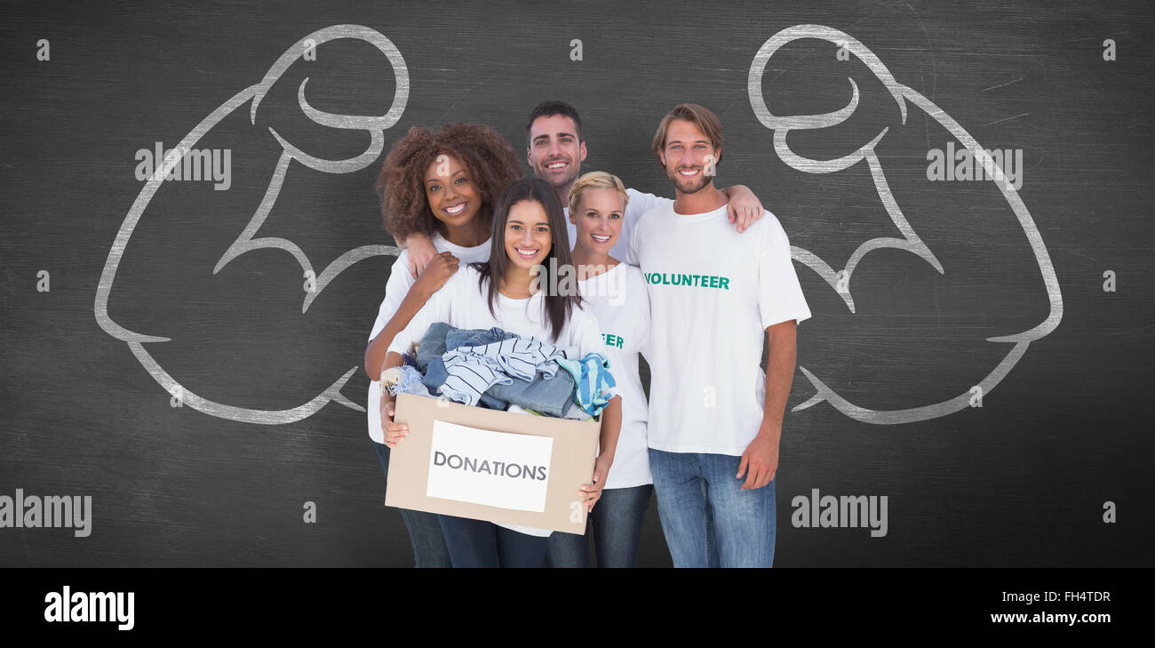 Composite image of smiling group of volunteers holding donation box Stock Photo