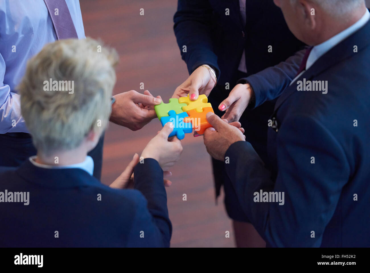 assembling jigsaw puzzle Stock Photo Alamy