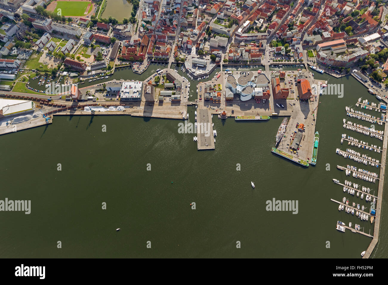 Aerial view, harbor, marina with the German Oceanographic Museum and Ozeaneum, Stralsund, with the moated city island Stock Photo