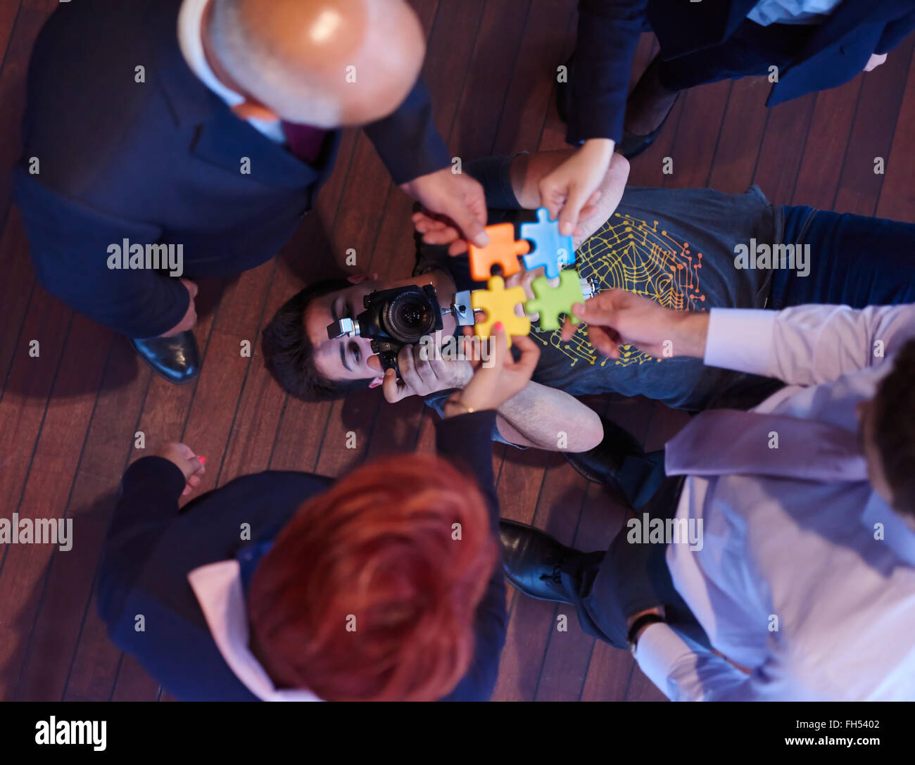 assembling jigsaw puzzle Stock Photo Alamy