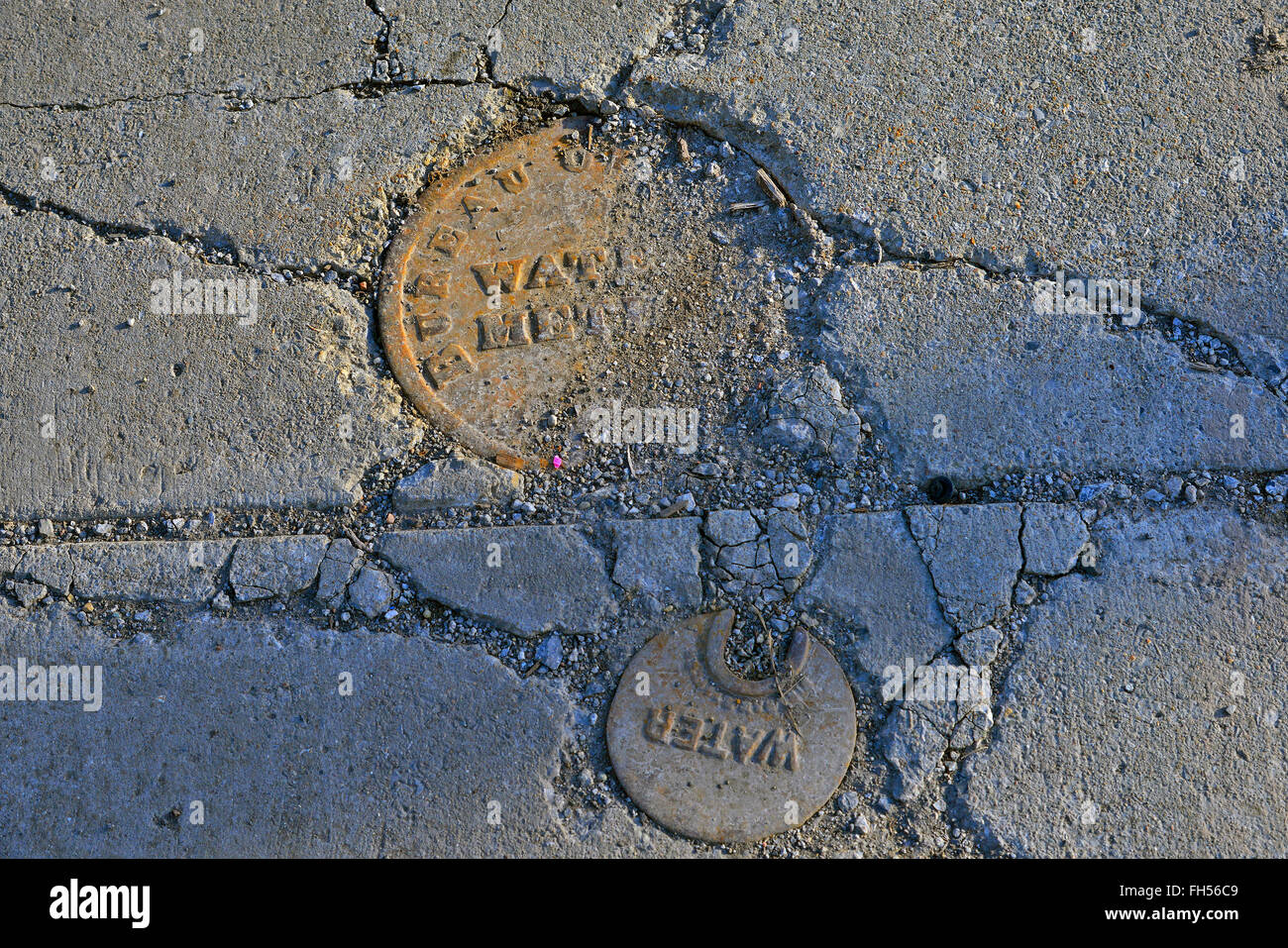 Sewer lids, utility access, drain covers, water meter access Stock Photo