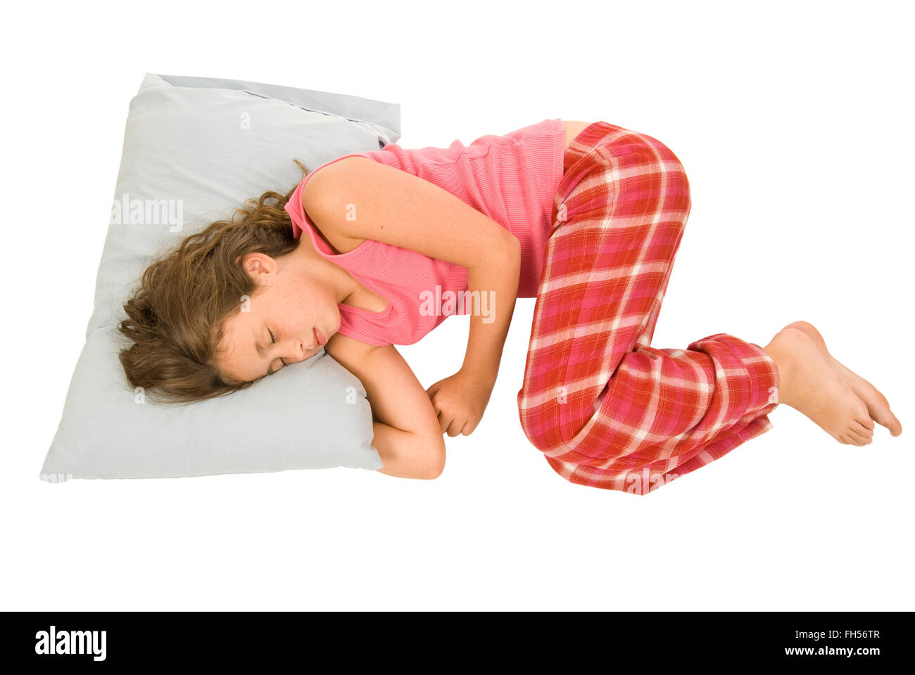 Little Girl Sleeping In Fetal Position Stock Photo