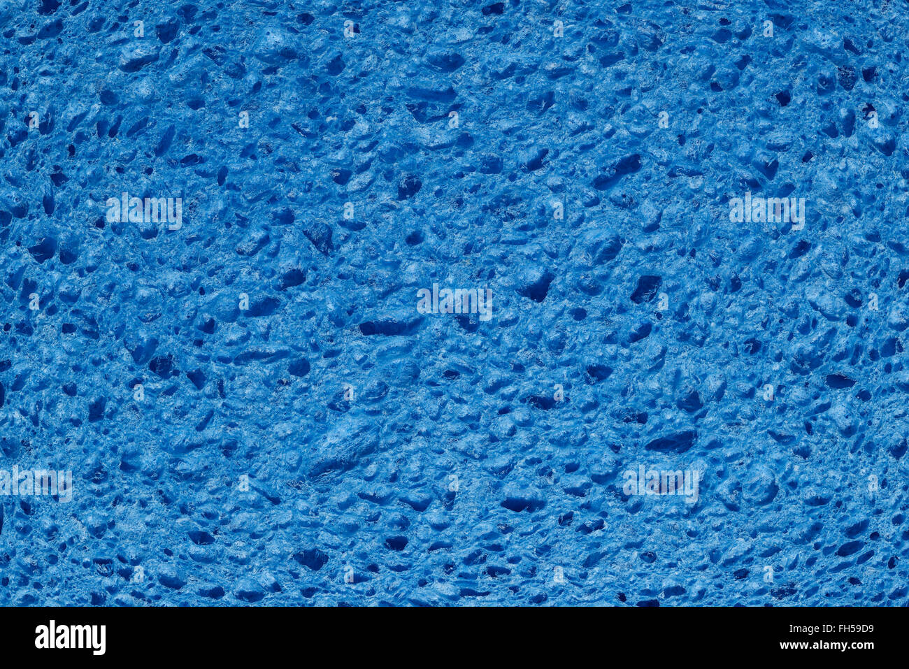 Close up detail of a blue coloured artificial sponge Stock Photo